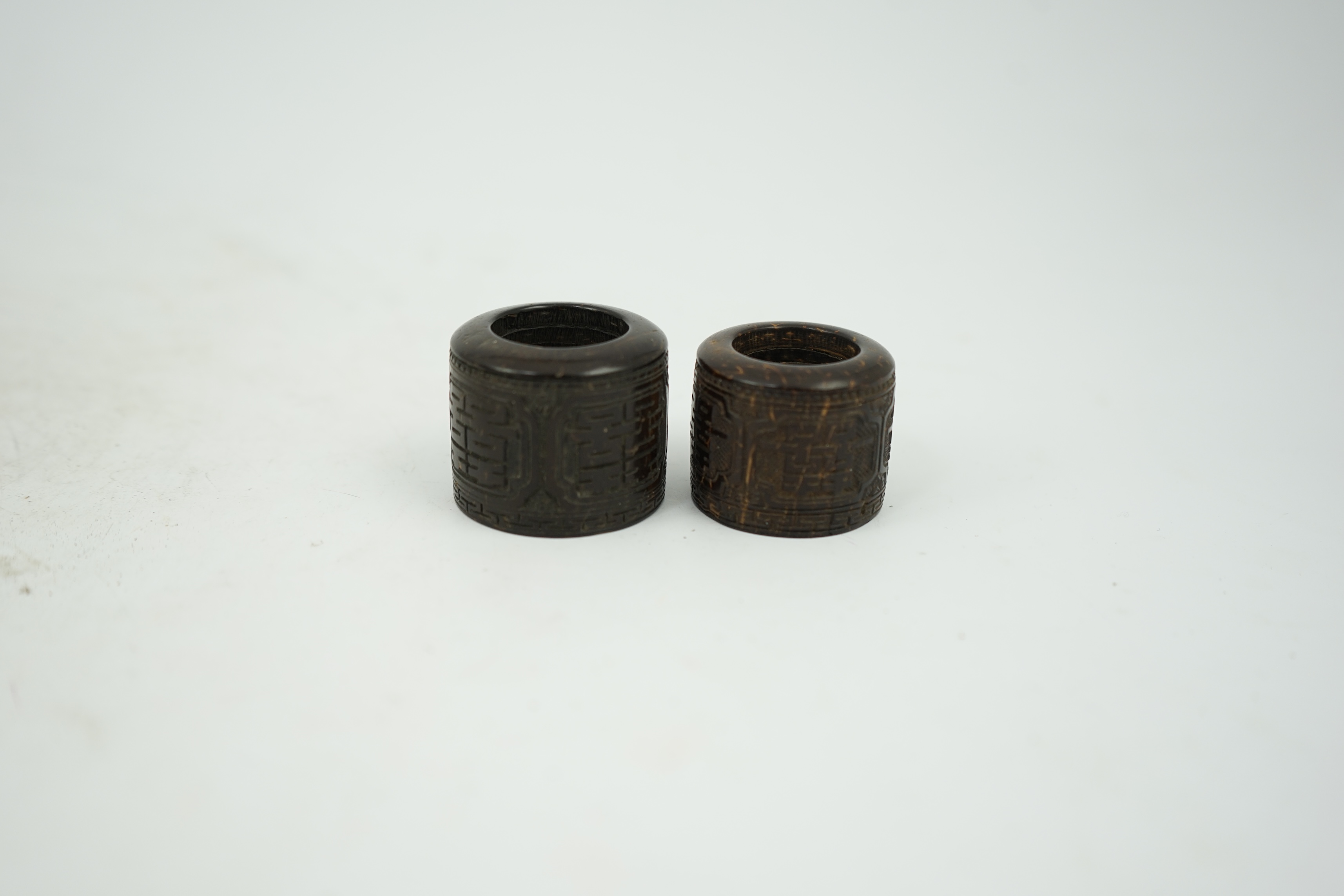 A pair of rare Chinese Straits palm wood archer's thumb rings, 19th century